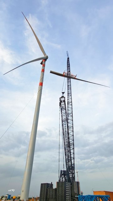 Crew guiding a turbine section into place