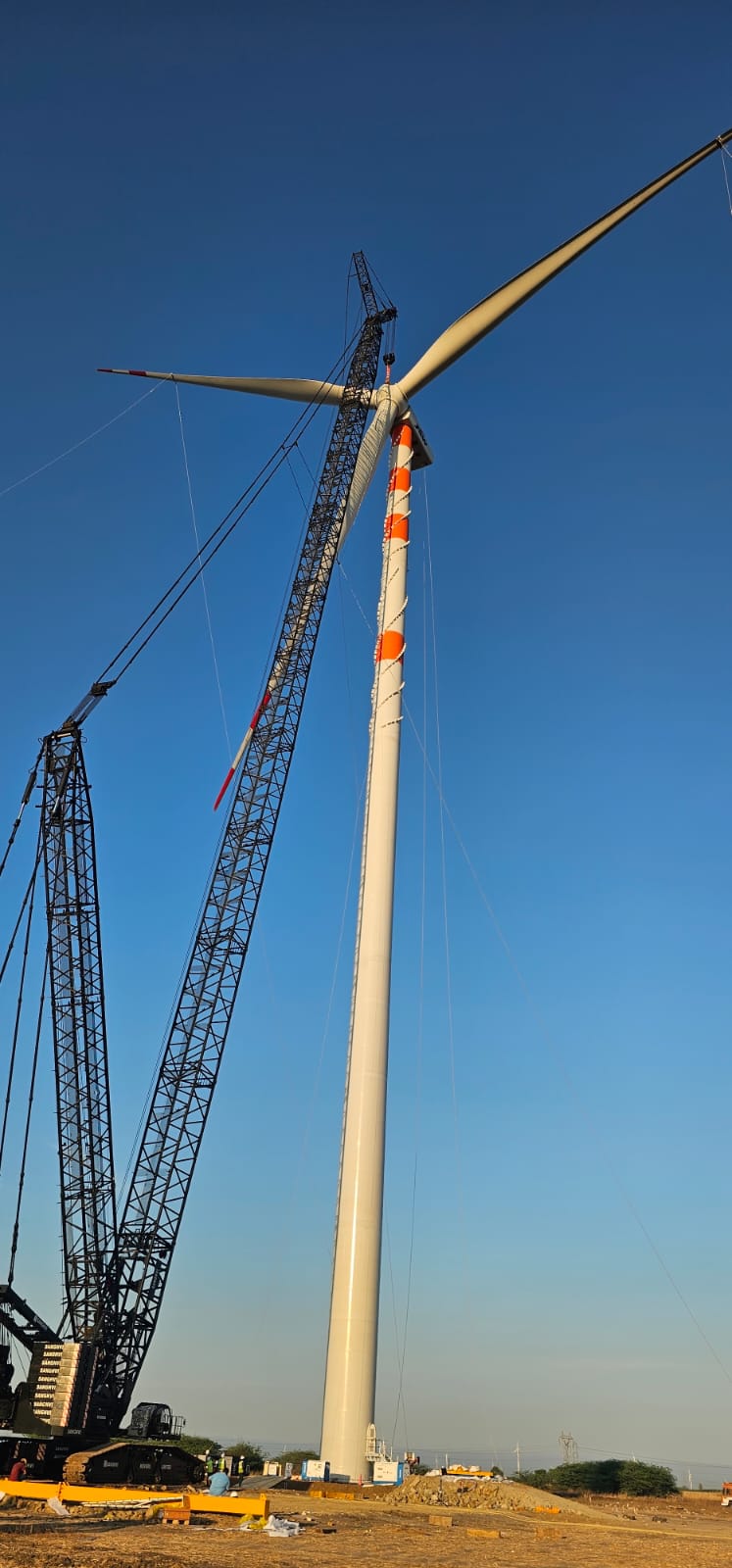 IWES engineers reviewing a wind turbine site