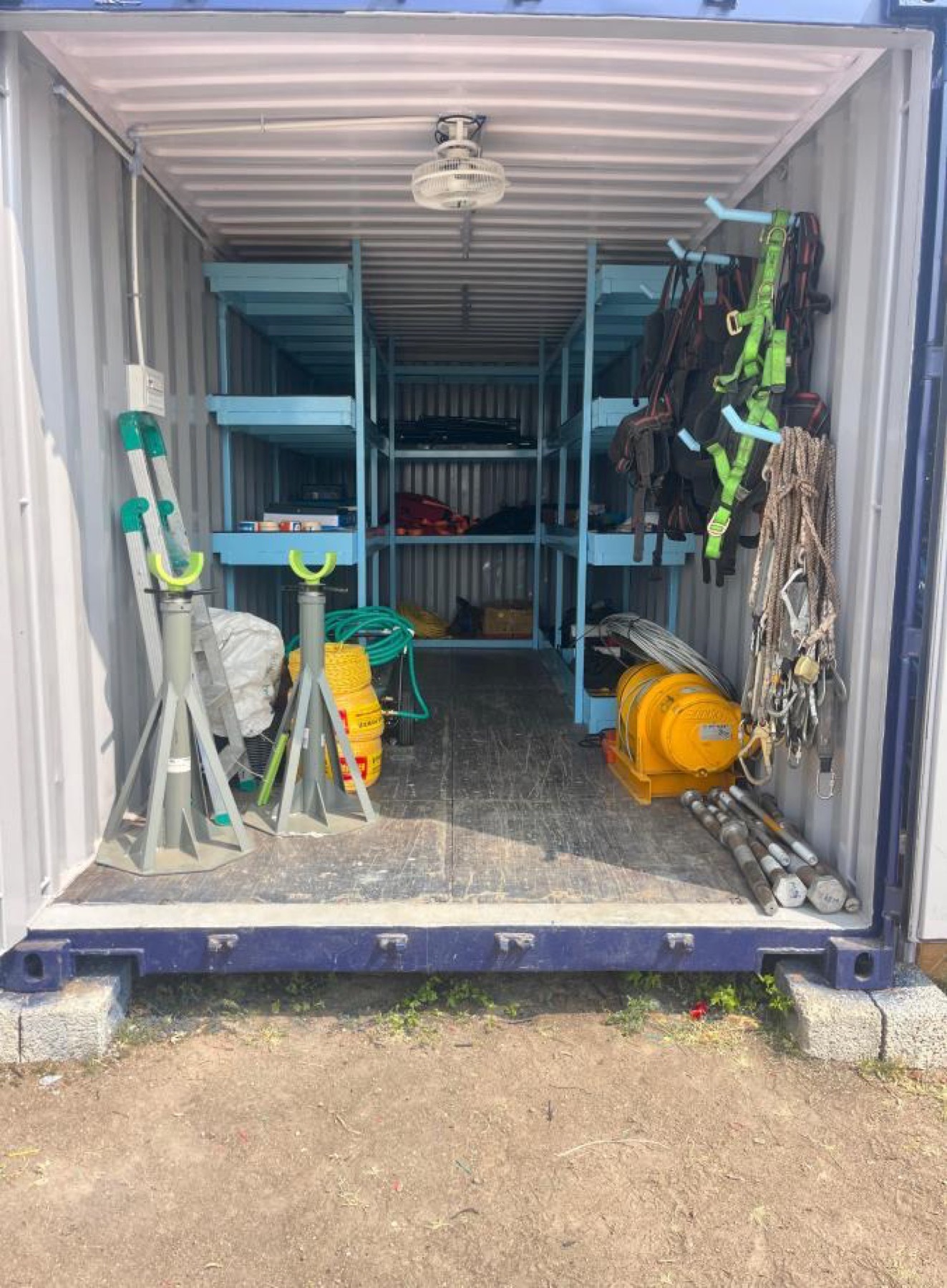 Site container with rigging, harnesses and safety equipment organised on shelves